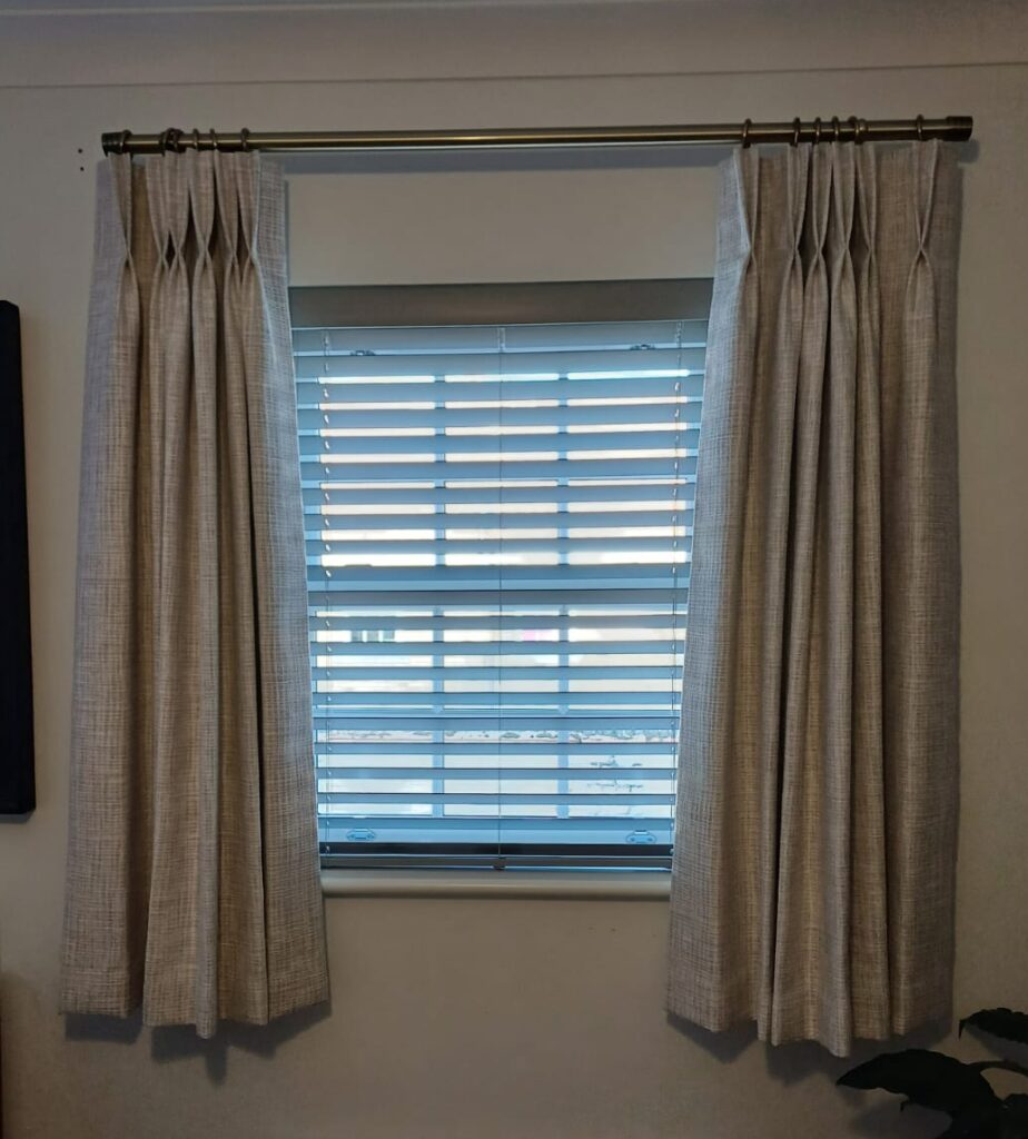 50mm Faux-wood blind. Pinch pleat curtains on a new pole.